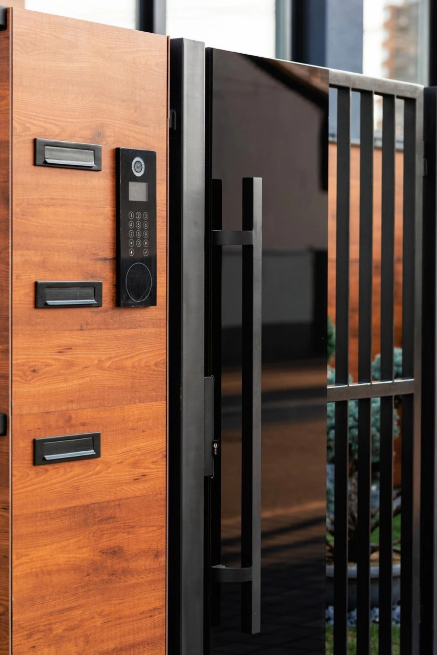 Secure commercial gate with modern access control keypad and electronic lock system.