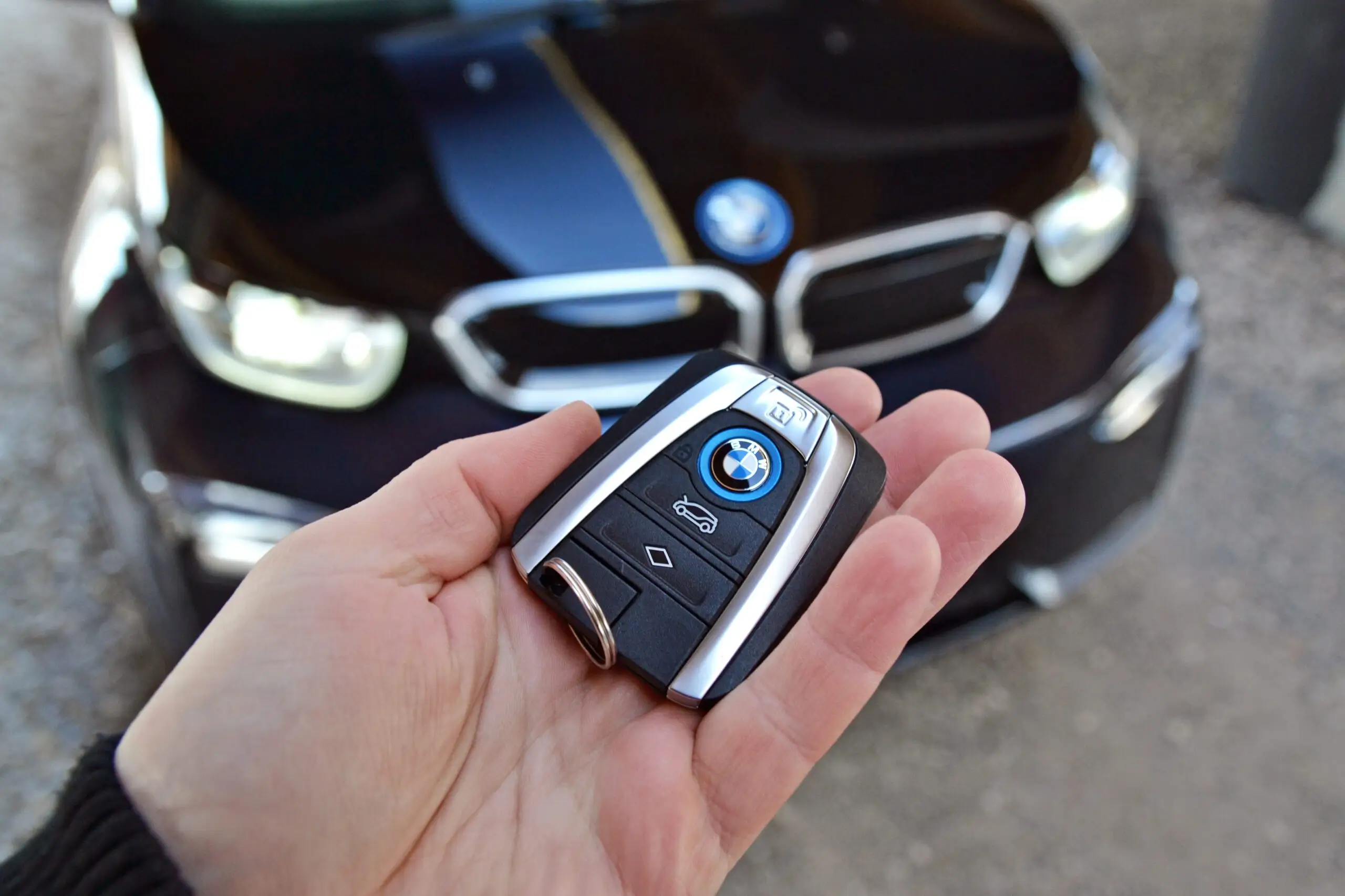 Mobile locksmith replacing a lost BMW key fob roadside