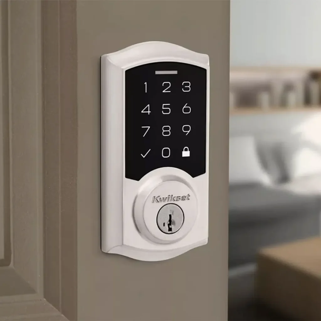Kwikset smart lock installed on a front door showing keypad and keyless entry features