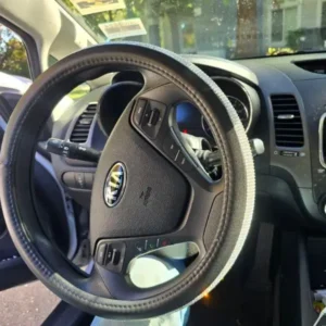 Close-up of 2017 Kia Forte steering wheel and dashboard after attempted theft in West Sacramento